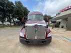 Exterior full front view for this 2021 Kenworth T680 Short Hood (Stock number: UMJ436671)