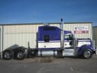 Exterior full passenger side for this 2021 Kenworth W900L (Stock number: UMR432642)