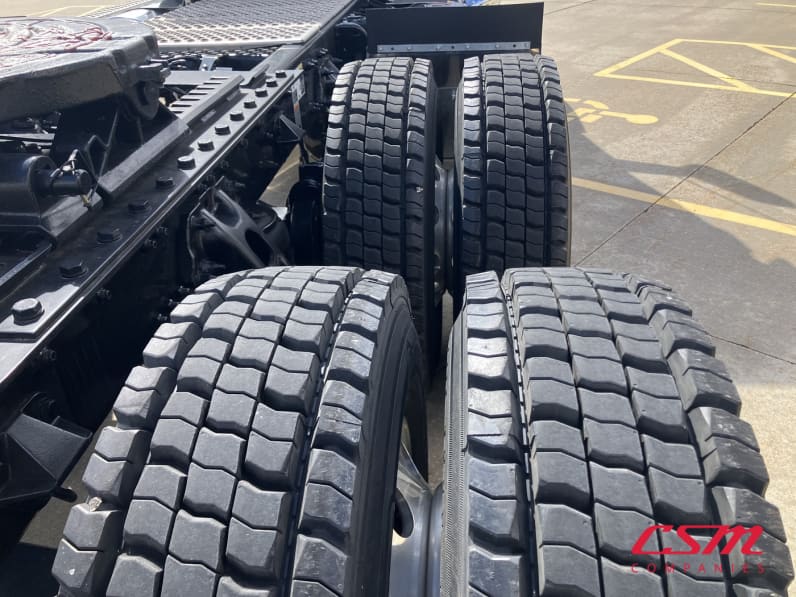 Passenger side rear frame and tire tread for this 2026 Kenworth T680 Short Hood (Stock number: TJ230322)