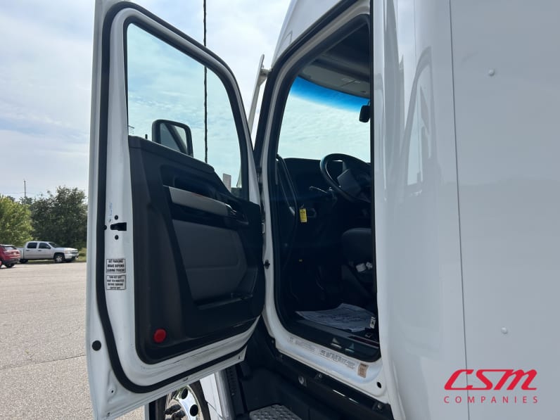 Drivers side door open for this 2023 Kenworth T680 (Stock number: UPJ216846)
