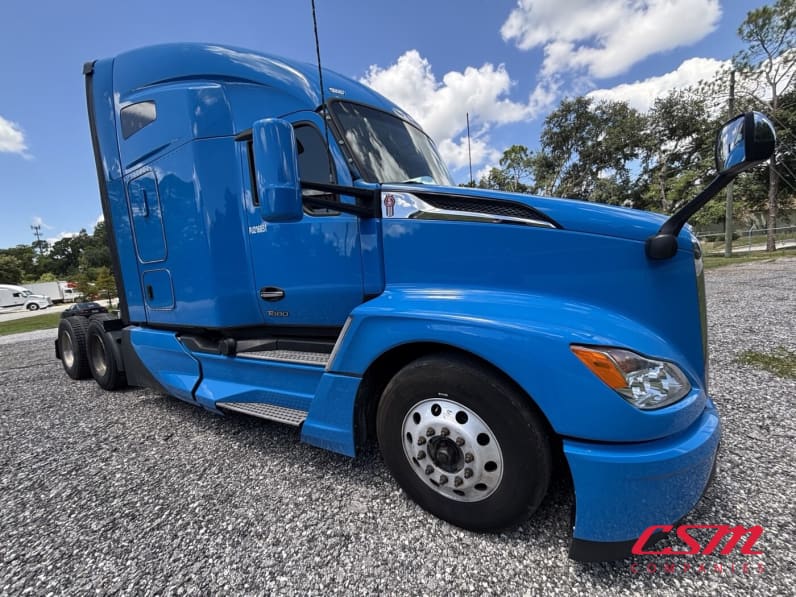 Exterior front passenger side for this 2023 Kenworth T680 (Stock number: UPJ216851)