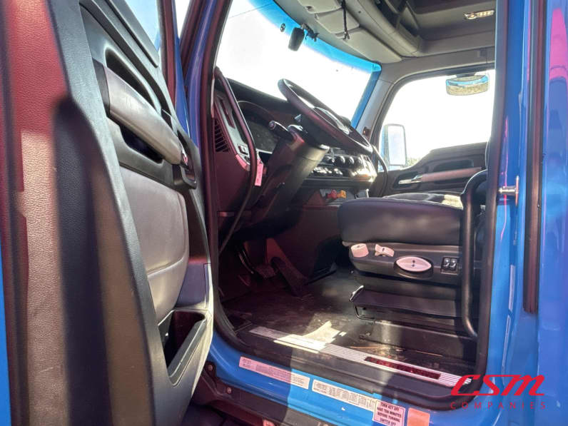 Drivers side door open for this 2023 Kenworth T680 (Stock number: UPJ216761)