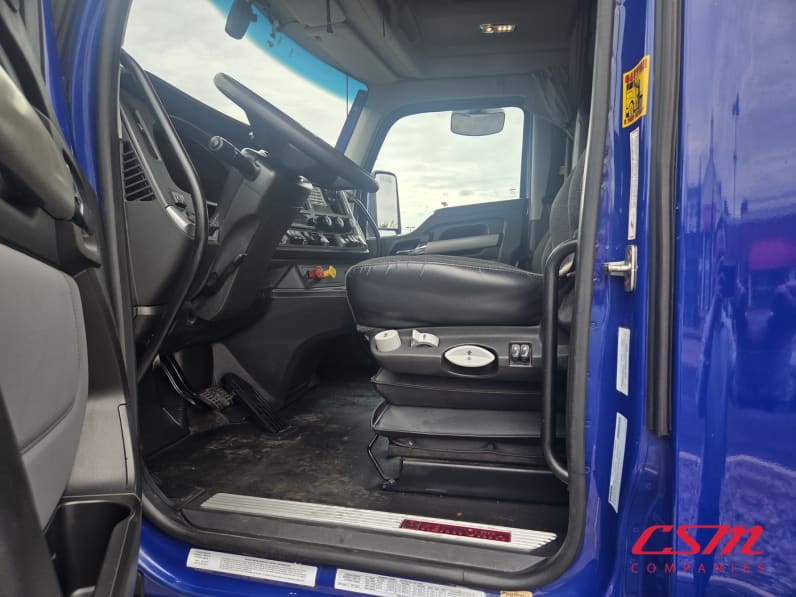 Drivers side door open for this 2023 Kenworth T680 (Stock number: UPJ216824)