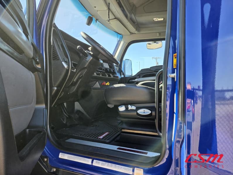 Drivers side door open for this 2023 Kenworth T680 (Stock number: UPJ216993)