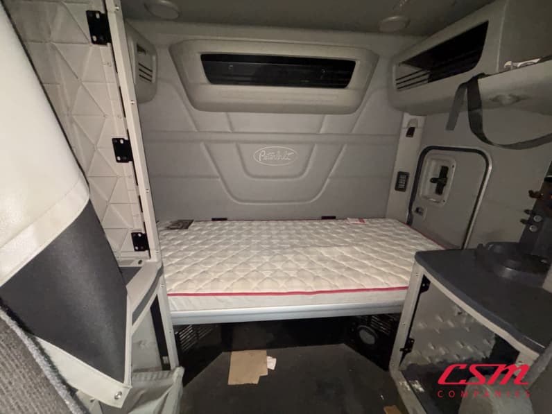 Interior wide sleeper view for this 2023 Peterbilt 579 (Stock number: UPD806298)