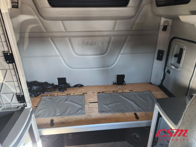 Interior wide sleeper view for this 2023 Peterbilt 579 (Stock number: UPD806295)