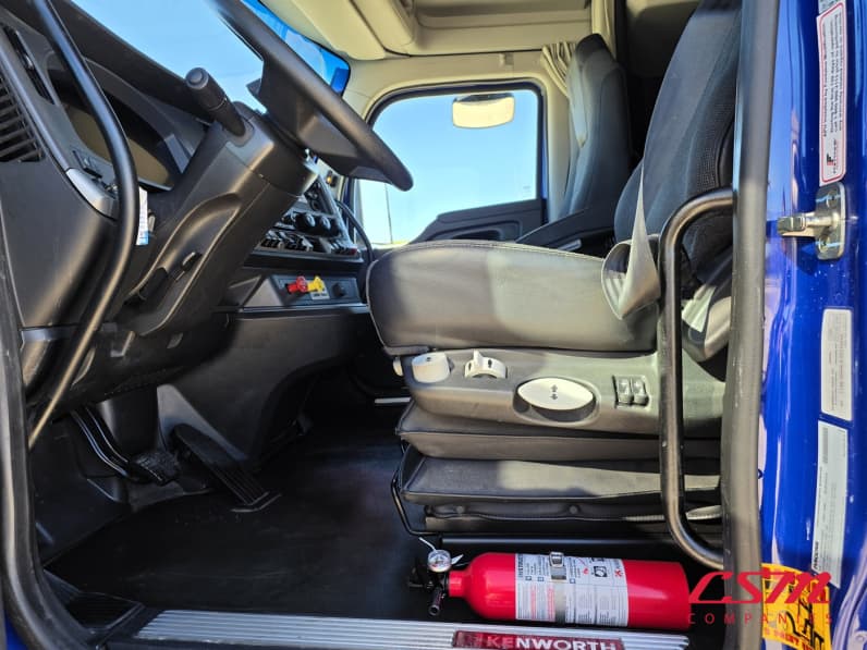 Drivers side door open for this 2023 Kenworth T680 (Stock number: UPJ216963)
