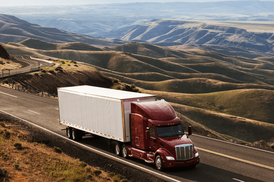 Class 8 semi truck descending a grade using its engine brake