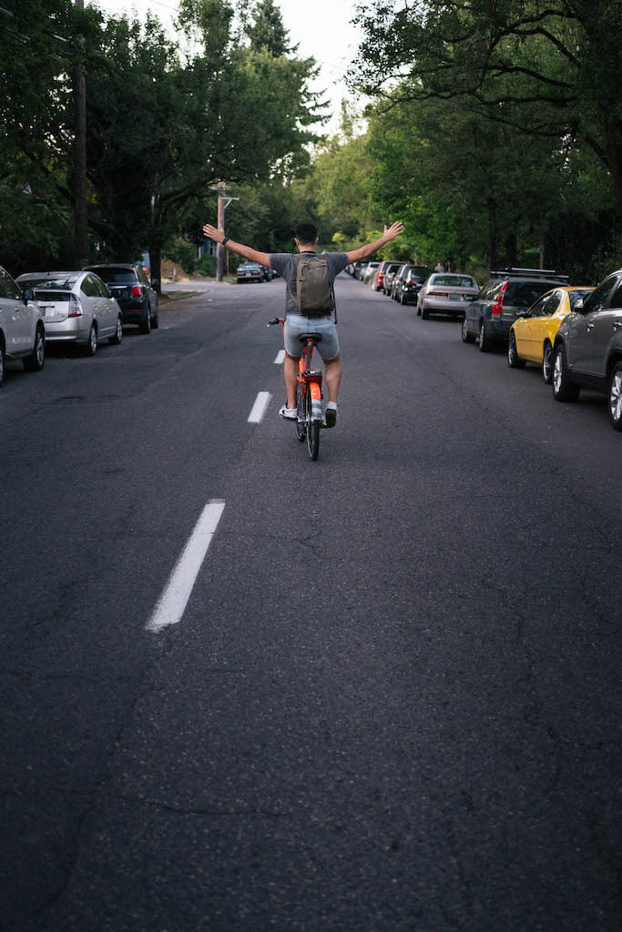 Payam riding a bike with no hands