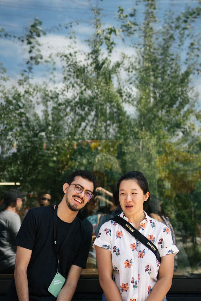 Jordan and Sarah in front of a restaurant window