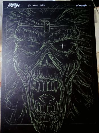 Image of Iron Maiden's Eddie face on Black paper