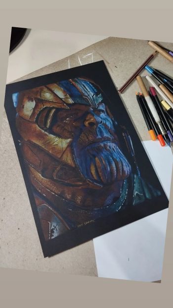 Image of Thanos art size ('9x12') 100% colored pencil on black canson paper, 180 grams.