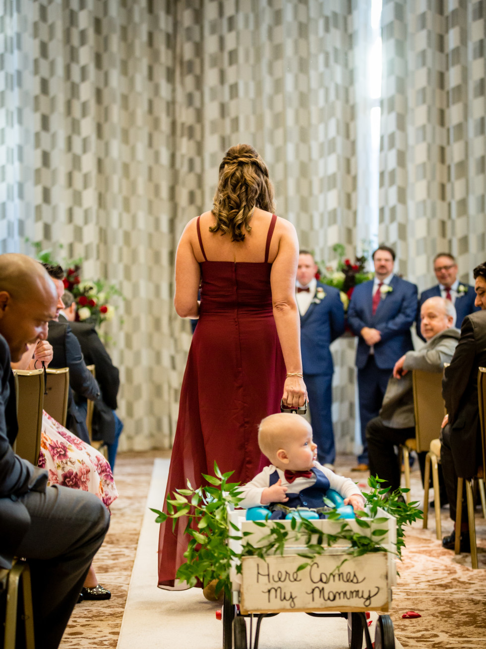 Denver being pulled down the aisle