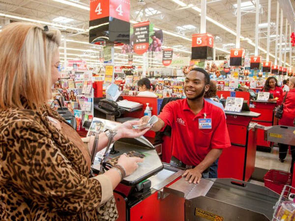 An H-E-B worker checks out a shopper