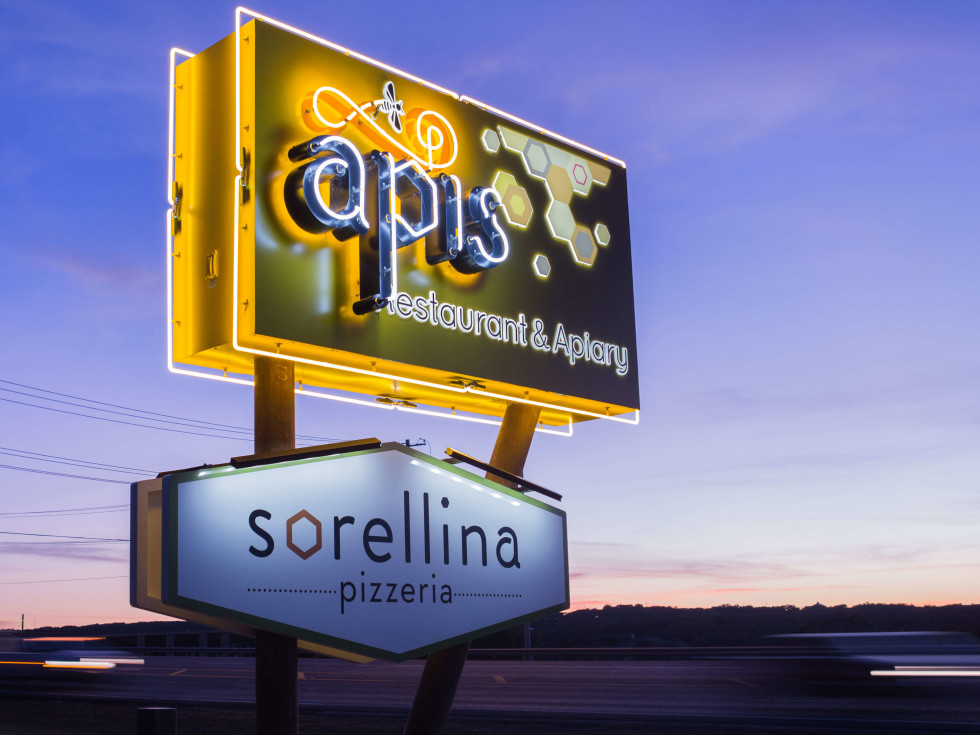 Apis Restaurant and Apiary Pizzeria Sorellina sign