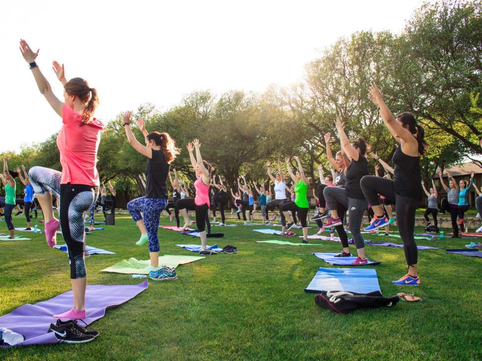 People practicing yoga outside