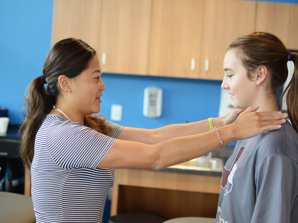 Doctor examining a teenage girl