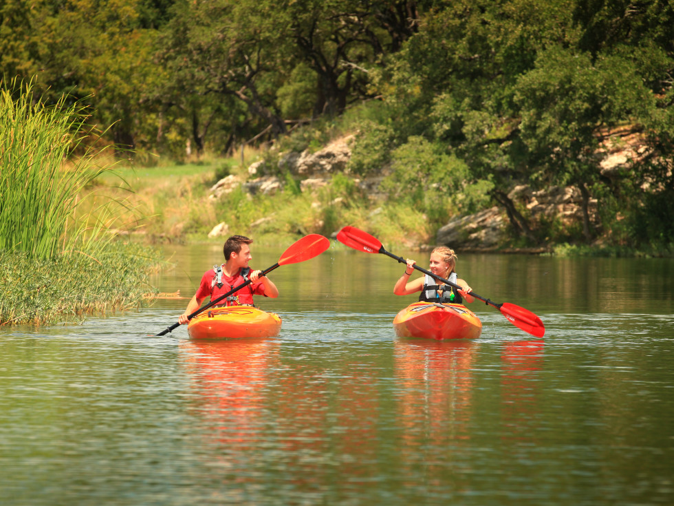 Kids kayaking on Onion Creek