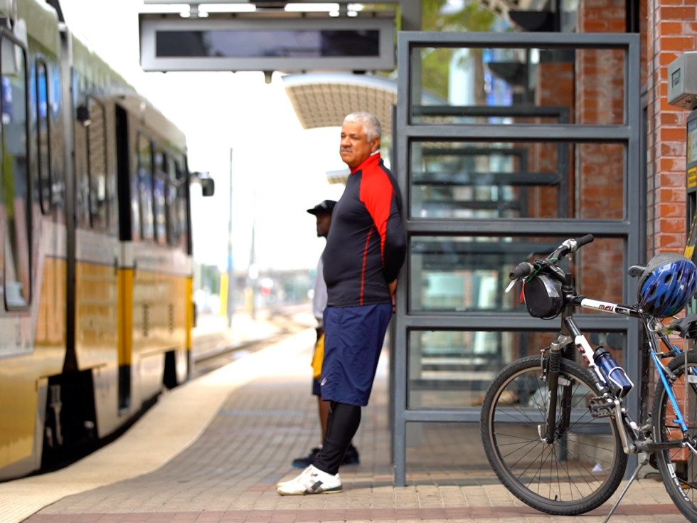 Man waits to board DART with his bike