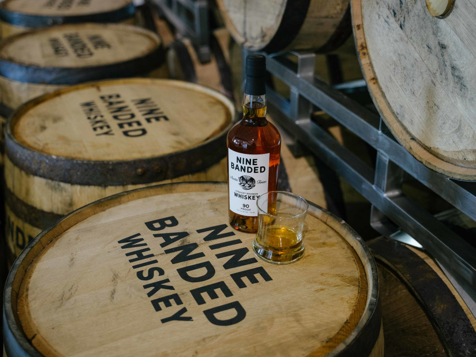 Nine Banded Whiskey on barrels