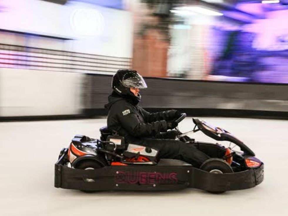 Someone races a Go Kart on ice