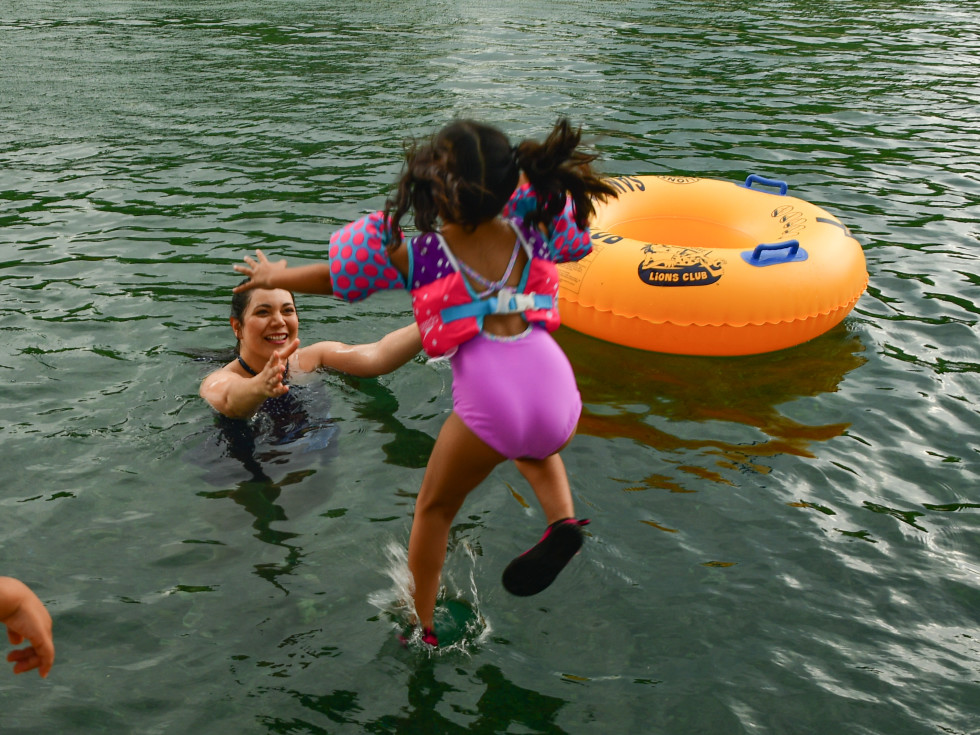 Kid jumping into the river