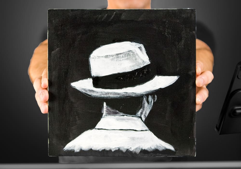 Man With White Hat On Black Surface