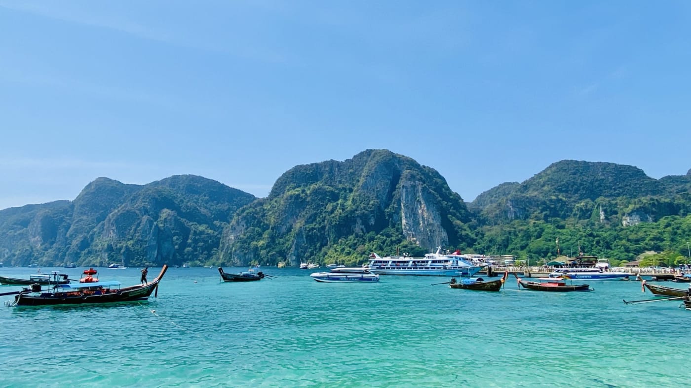 Longtail boats on the turquoise water of Phi Phi Island, Thailand