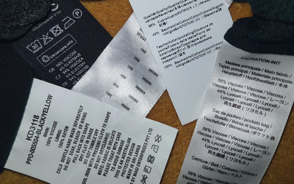 A selection of clothing labels showing composition and make of clothing