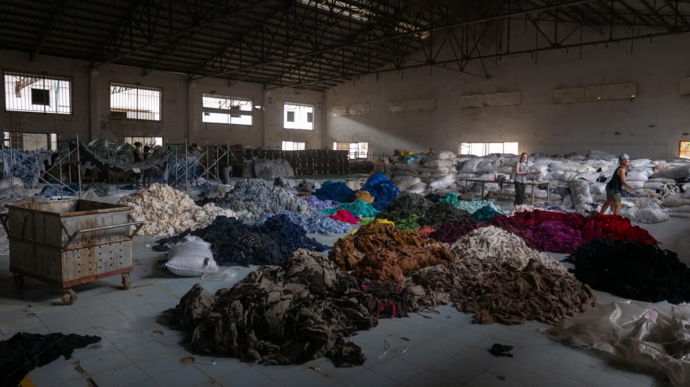 Hundreds of tons of clothing found in an abandoned factory in 2020 Sorting through hundreds of tons of clothing in an abandoned factory for a social mission called Clothing the Loop<strong>.</strong>