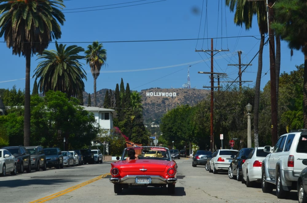 Local LA road leading to the Hollywood sign in the background