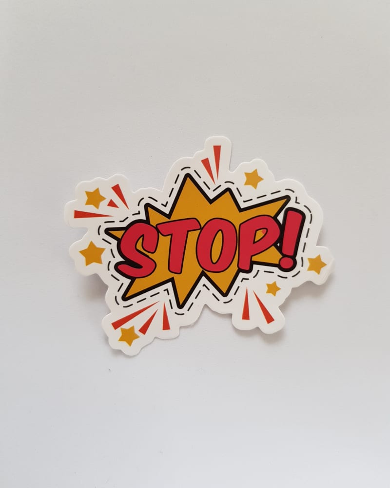 White background with a colourful fabric badge that reads 'Stop'