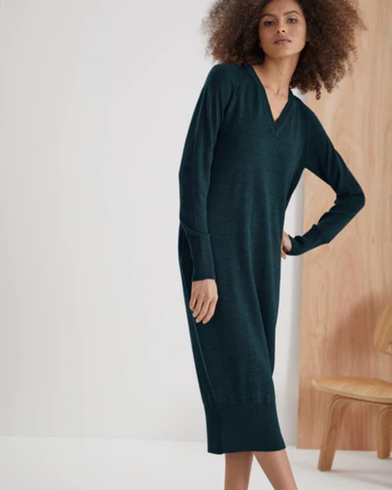 Ponti V-Neck Relaxed Fit Dress @ Concrete London Woman wearing midi length knit long sleeves dress in dark green