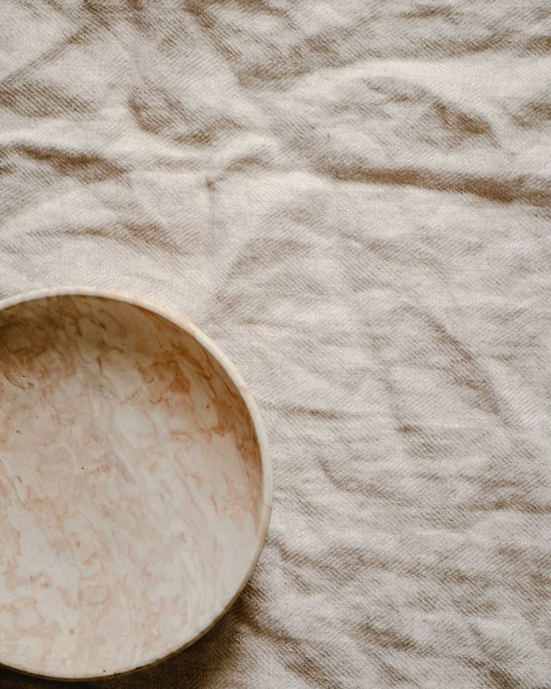 Linen Fabric A marble bowl on linen fabric