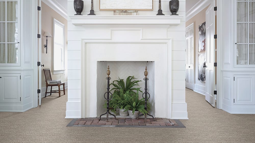 Wethersfield Wool Blend Carpet in Wall-to-Wall Installation around Fireplace