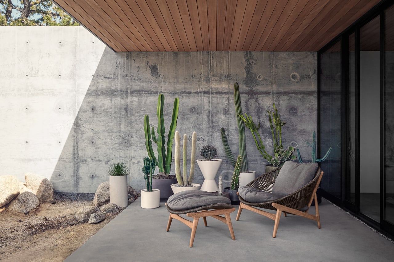 Gloster Bora Lounge Chair outside of a porch under a roof