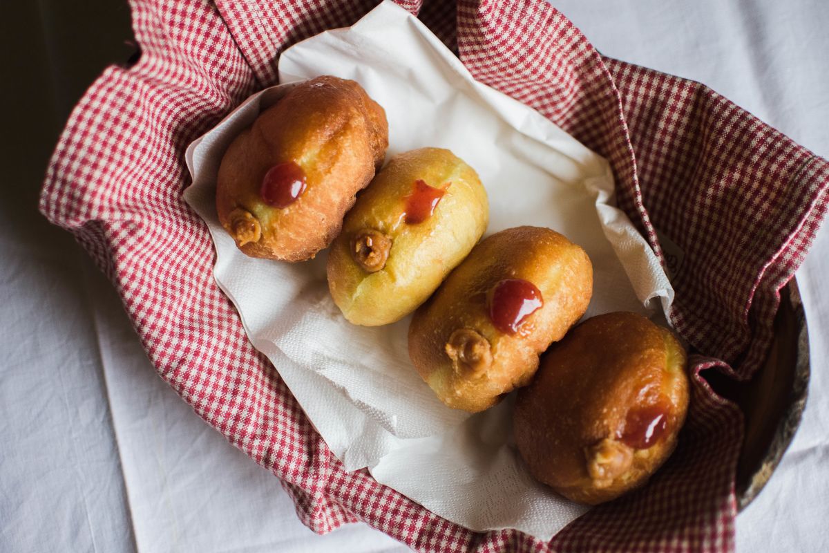 Delicious peanut-butter and jelly filled vegan donuts.