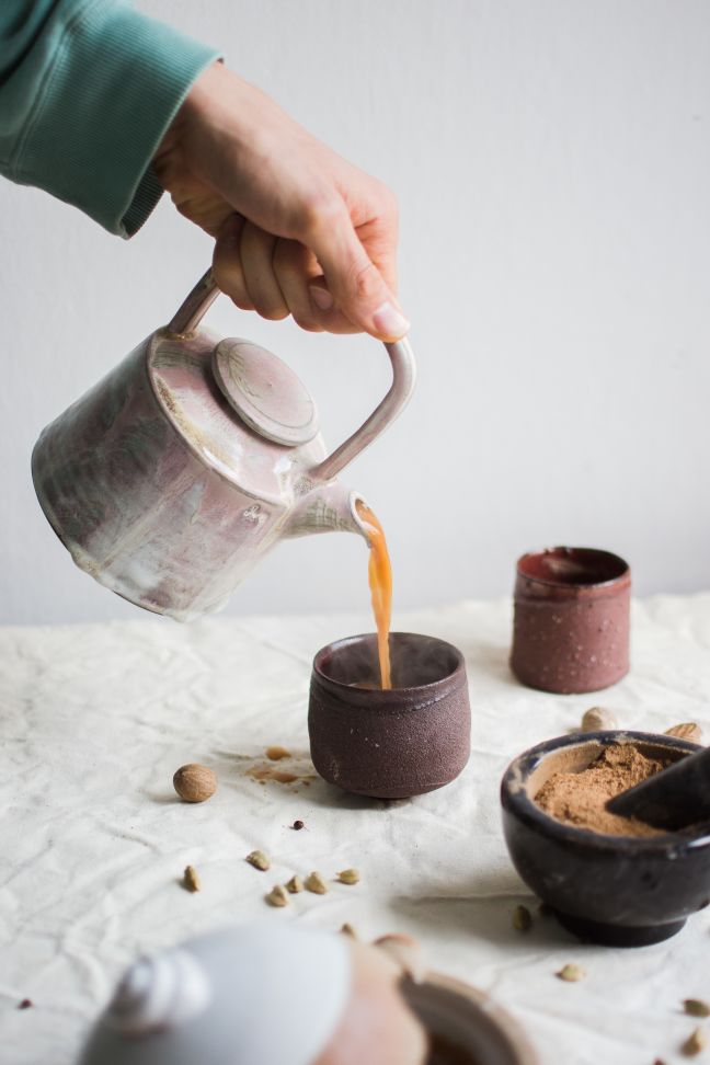 Delicious masala chai being poured.
