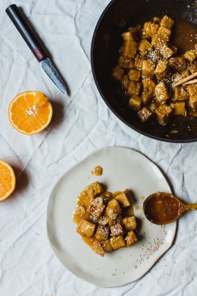 Pan glazed tempeh in orange sauce.