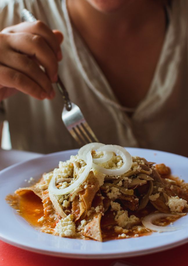 chilaquiles with salsa roja and onion