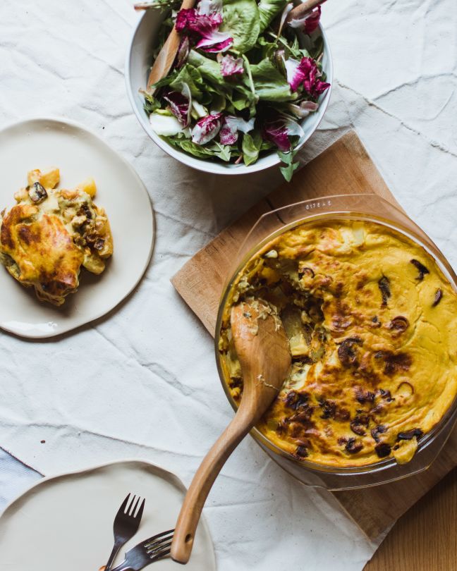 Vegan tartiflette served with salad.