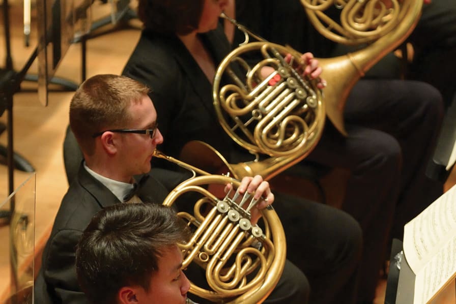 Ray Seong Jin Han, Eric Huckins, Bryn Coveney playing horn in the Curtis Symphony Orchestra