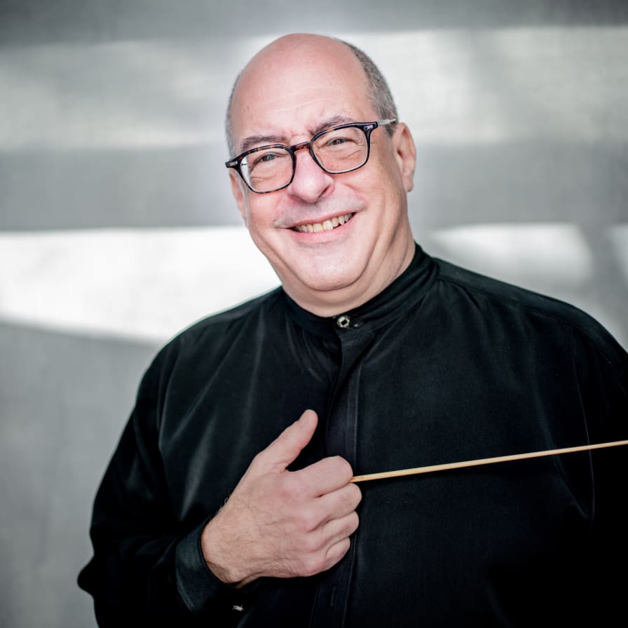 Portrait of Robert Spano holding a baton while holding a baton.