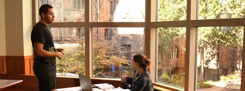 Students on Curtis' campus engaged in conversation.