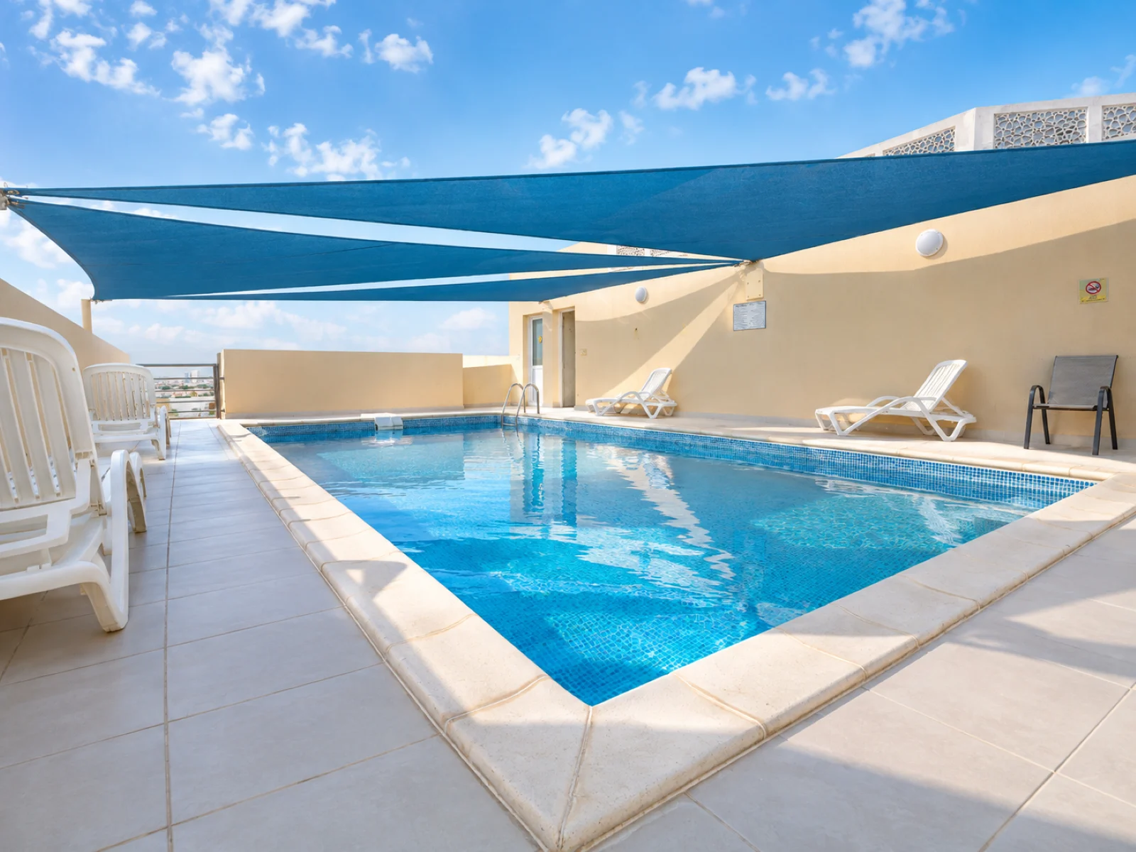 Sunny Rooftop Pool Retreat