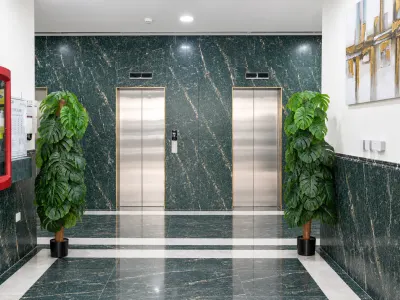 Symmetrical Green Marble Elevator Lobby