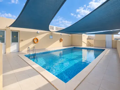 Rooftop Pool Under Blue Shade Sails