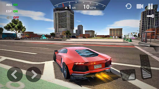 Ultimate Car Driving Simulator 10.2.6 – red mid-engined supercar at a city crossroads with office towers behind, the HUD showing ABS and ESP on, first gear and 10 km/h, arrow steering buttons and pedals on screen
