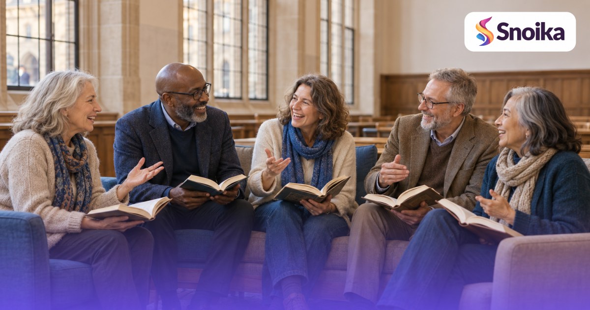 Five people in their fifties and sixties in an university hall with tall windows and wooden benches.