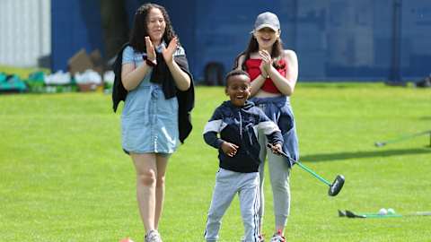 Children having fun hitting their own shots